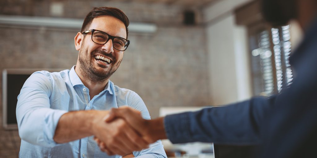 Professional business handshake in office